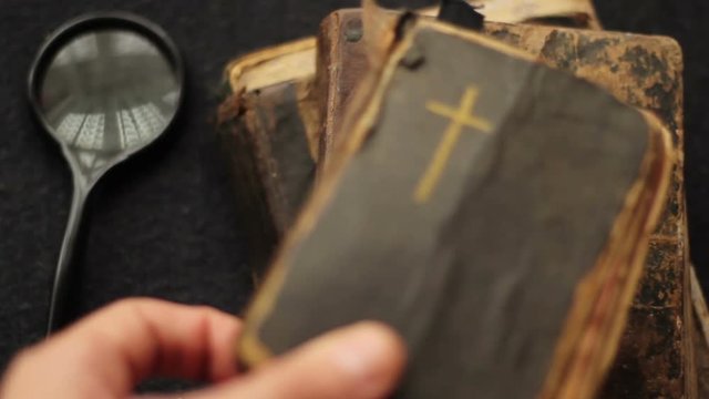 Putting down vintage books and the Bible.