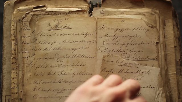 Turning pages  in a vintage book.