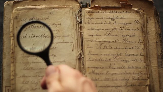 Magnifying glass and vintage book.
