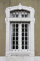 Fototapeta na wymiar Renaissance window with grate