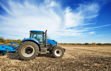 Agricultural tractor in the field