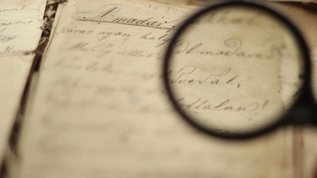 Magnifying glass and vintage book.