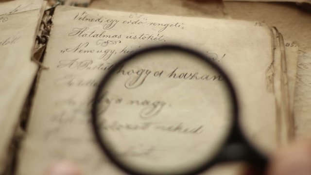 Magnifying glass and vintage book.