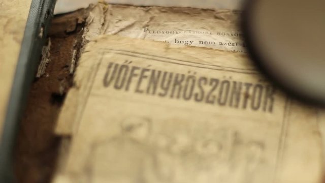 Magnifying glass and vintage book.