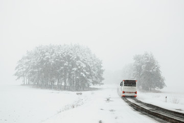 Traffic on the road in bad weather conditions in winter
