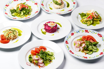 Different spring salads in plates