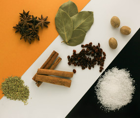 Spices on a striped yellow black background
