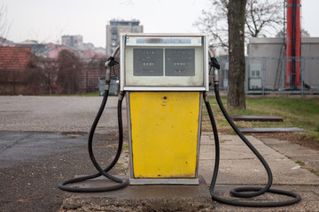Rusted, old and abandoned gas dispenser in a former petrol station shot in the suburb of Belgrade,...