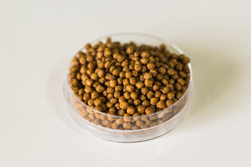 Fish feed isolated background