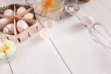Baking ingredients on white rustic wood background, copy space