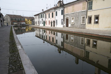 Fototapeta na wymiar Comacchio, Ferrara, Italy: houses reflected in the canal