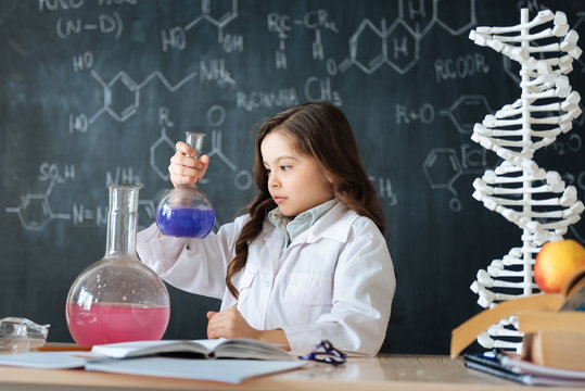 Inventive little scientist studying chemistry in the laboratory