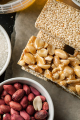 Peanut and sesame brittle closeup shot, top view, vertical