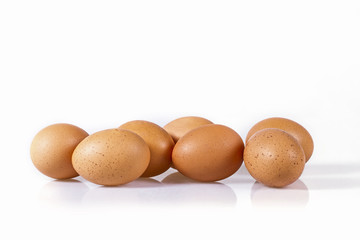 Brown chicken eggs isolated on a white background