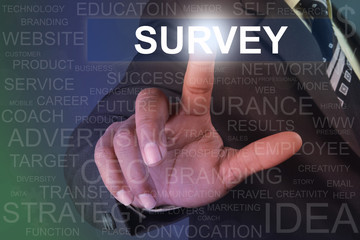 Businessman touching survey button on virtual screen