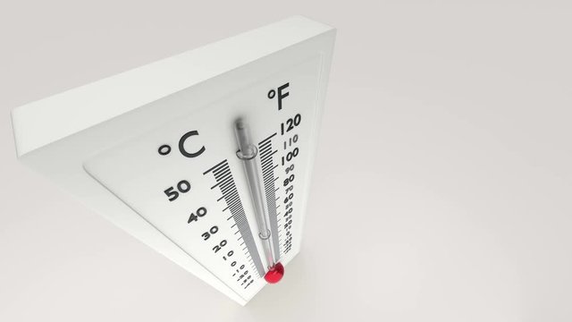 View of a thermometer from above in which the temperature gauge grows.