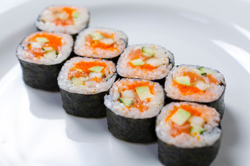 Rolls on the white plate. Japanese cuisine