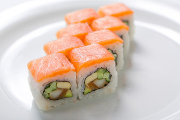 Rolls on the white plate. Japanese cuisine