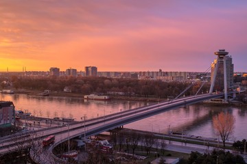 Obraz premium Bratislava, Slovakia - March 19, 2017: New Futuristic Bridge in Bratislava at sunset (City view at sunset)
