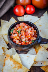 Hot mexican salsa - spicy dip with nachos - chips from corn