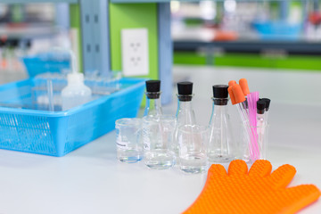 Beaker, flask, tube and glove for experiment chemical in Lab.
