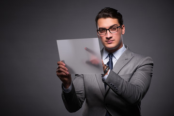 Handsome businessman working on tablet computer