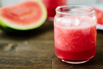 Delicious watermelon smoothie on the wooden board. Smoothie - vegetarian coctail from fresh fruit - watermelon