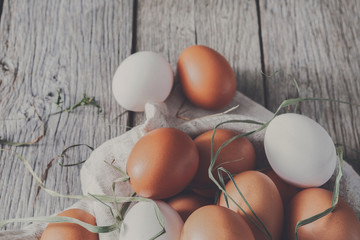 Fresh chicken brown eggs on rustic wood, organic farming concept