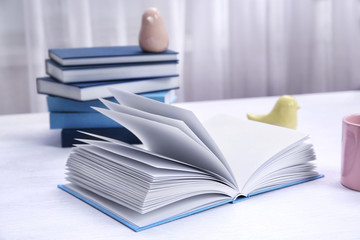 Open book on wooden table