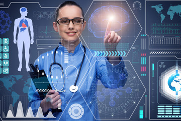 Doctor in futuristic medical concept pressing button