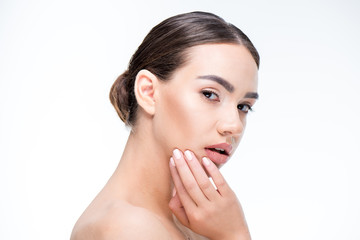 Fototapeta premium Beautiful woman touching face