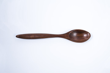 Wooden spoon isolated on a white background