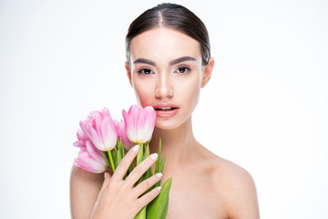 Obraz na płótnie Canvas Woman with pink tulips bouquet