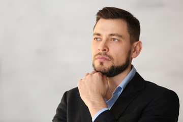 Confident young manager on blurred background © Africa Studio