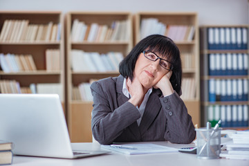 Mature businesswoman working in the office