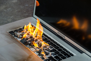 Laptop keyboard on fire and melting