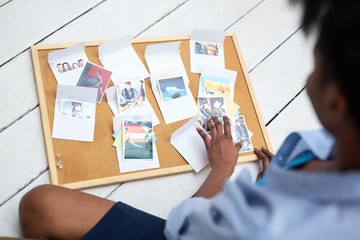 Several envelopes with pictures of humans inside on design board