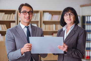 Businesspeople discussing business results on tablet computer