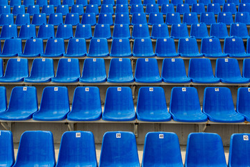 Dark blue rows of seats on the stadium