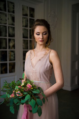 bride posing with flowers