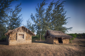 Isolated huts at sunset in Kenya