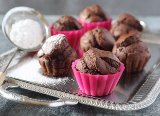 Chocolate muffins on vintage tray. Focus selective