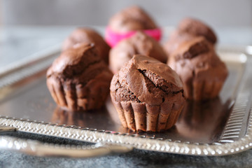 Chocolate muffins on vintage tray. Focus selective