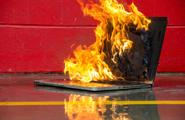 Laptop computer set on fire and burning intensely