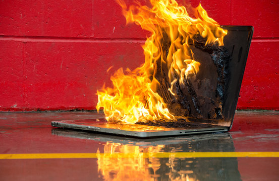 Laptop Computer Set On Fire And Burning Intensely