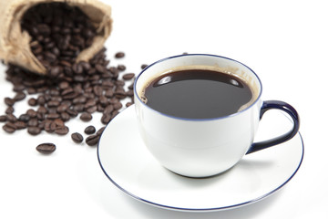Coffee in white cup and blur coffee seed in sack for background, Isolate image
