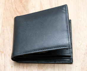 Black Wallet on Wooden table