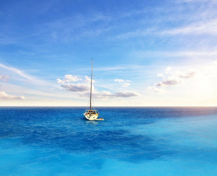 Sailing boat anchoring on open ocean, sailing and travel theme