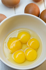 Raw eggs on a white background