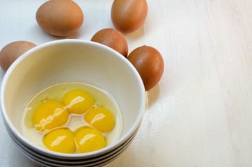 Raw eggs on a white background